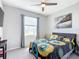 Bedroom with a queen bed, featuring a bridge picture and window at 8857 Sw 50Th Ter, Ocala, FL 34476