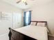Bedroom with a full bed, featuring blue curtains and a rocking chair at 8857 Sw 50Th Ter, Ocala, FL 34476