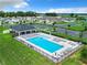 Community pool with lounge area and shaded seating at 8857 Sw 50Th Ter, Ocala, FL 34476