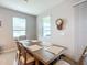 Dining room featuring a wooden table and neutral decor at 8857 Sw 50Th Ter, Ocala, FL 34476