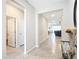 Hallway view of entryway, powder room, and living room at 8857 Sw 50Th Ter, Ocala, FL 34476