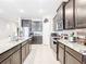 Open concept kitchen with island and stainless steel appliances at 8857 Sw 50Th Ter, Ocala, FL 34476