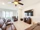 Spacious living room with sectional sofa and large TV at 8857 Sw 50Th Ter, Ocala, FL 34476