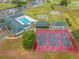 Three community tennis courts with pool in view at 5495 Nw 23Rd Pl, Ocala, FL 34482