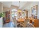 Bright dining room featuring a wood table and chairs, hardwood floors, and built-in hutch at 5495 Nw 23Rd Pl, Ocala, FL 34482