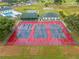 Aerial view showing three tennis courts at 5495 Nw 23Rd Pl, Ocala, FL 34482