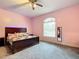 Spacious bedroom with a large bed and window at 6615 Se 158Th Pl # 6, Summerfield, FL 34491
