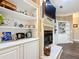 Fireplace with built-in shelving on either side at 6615 Se 158Th Pl # 6, Summerfield, FL 34491