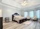 Spacious primary bedroom with hardwood floors and ample natural light at 6615 Se 158Th Pl # 6, Summerfield, FL 34491