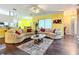 Open living room with sectional sofa and view into kitchen area at 6615 Se 158Th Pl # 6, Summerfield, FL 34491