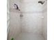 Clean shower with tiled walls and a glass-block accent at 6615 Se 158Th Pl # 6, Summerfield, FL 34491