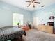 Light and airy bedroom with cloud wall art and ample space at 6615 Se 158Th Pl # 6, Summerfield, FL 34491