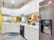 Well-equipped kitchen with white cabinets and modern appliances at 6615 Se 158Th Pl # 6, Summerfield, FL 34491