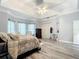 Large bedroom with a king-size bed and plenty of natural light at 6615 Se 158Th Pl # 6, Summerfield, FL 34491