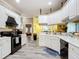 Spacious kitchen featuring white cabinetry and a large island at 6615 Se 158Th Pl # 6, Summerfield, FL 34491