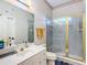 Clean bathroom with single vanity, shower and toilet at 6615 Se 158Th Pl # 6, Summerfield, FL 34491