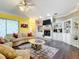Spacious living area with fireplace, built-ins and hardwood floors at 6615 Se 158Th Pl # 6, Summerfield, FL 34491