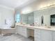 Elegant bathroom with double vanity, large mirror, and soaking tub at 6615 Se 158Th Pl # 6, Summerfield, FL 34491