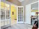 Home office with French doors, and views into adjacent living areas at 6615 Se 158Th Pl # 6, Summerfield, FL 34491