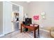 Home office with wood desk and view into living room at 6615 Se 158Th Pl # 6, Summerfield, FL 34491