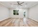 Bright bedroom with hardwood floors and access to balcony at 125 Se Watula Ave, Ocala, FL 34471