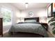 Cozy bedroom with double bed and wood nightstands at Tbd Bay Ct, Ocklawaha, FL 32179