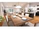Open dining room with wood table and kitchen view at Tbd Bay Ct, Ocklawaha, FL 32179