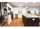 Modern kitchen with stainless steel appliances and an island at Tbd Bay Ct, Ocklawaha, FL 32179
