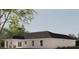 Home's back elevation showcasing a covered patio area and nicely landscaped yard at Tbd Bay Ct, Ocklawaha, FL 32179