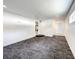 Large spare bedroom with grey carpet and access to other rooms at 4612 Bradley Ave, Orlando, FL 32839