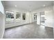 Modern bedroom with mirrored closet and gray flooring at 4612 Bradley Ave, Orlando, FL 32839
