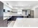 Modern kitchen with white cabinets and marble countertops at 4612 Bradley Ave, Orlando, FL 32839