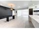 Modern dining area with a large black table and chandelier at 4612 Bradley Ave, Orlando, FL 32839