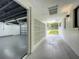 Bright garage entry with concrete floor and access to backyard at 4612 Bradley Ave, Orlando, FL 32839