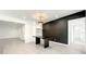 Modern dining area with black accent wall and chandelier at 4612 Bradley Ave, Orlando, FL 32839