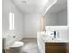 Modern bathroom with double vanity and toilet at 4612 Bradley Ave, Orlando, FL 32839