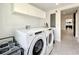 Updated laundry room with washer, dryer, and cabinets at 4612 Bradley Ave, Orlando, FL 32839