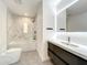 Modern bathroom with marble tile and floating vanity at 4612 Bradley Ave, Orlando, FL 32839