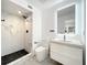 Modern bathroom with marble shower and floating vanity at 4612 Bradley Ave, Orlando, FL 32839
