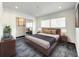 Modern bedroom with a king-size bed and mirrored closet at 4612 Bradley Ave, Orlando, FL 32839