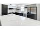 Modern kitchen with marble countertops and stainless steel appliances at 4612 Bradley Ave, Orlando, FL 32839