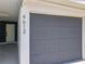 Modern gray two-car garage with automatic door at 4612 Bradley Ave, Orlando, FL 32839