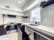 Modern kitchen with a sink and marble countertops at 4612 Bradley Ave, Orlando, FL 32839