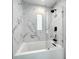 Modern bathroom with marble tile and glass shower at 4612 Bradley Ave, Orlando, FL 32839
