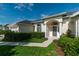 Inviting front entrance with columns, arched entryway and well-manicured landscaping at 2260 Nw 51St Ter, Ocala, FL 34482