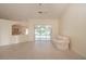Bright living room with tile floors, sliding glass doors, and a view of the backyard at 2260 Nw 51St Ter, Ocala, FL 34482
