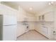 White kitchen with ample counter space and modern appliances at 2260 Nw 51St Ter, Ocala, FL 34482