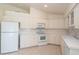 Clean kitchen featuring white cabinets and a breakfast nook at 2260 Nw 51St Ter, Ocala, FL 34482