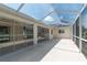 Enclosed patio with glass doors and view of the backyard at 2260 Nw 51St Ter, Ocala, FL 34482