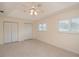 Bright bedroom featuring double closets, tile floors, and a ceiling fan at 2260 Nw 51St Ter, Ocala, FL 34482